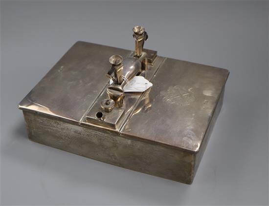 A late Victorian silver smokers compendium, modelled as a double lidded box, with single handle.